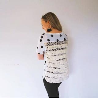 Hayley Cooper models a polka dot shirt.